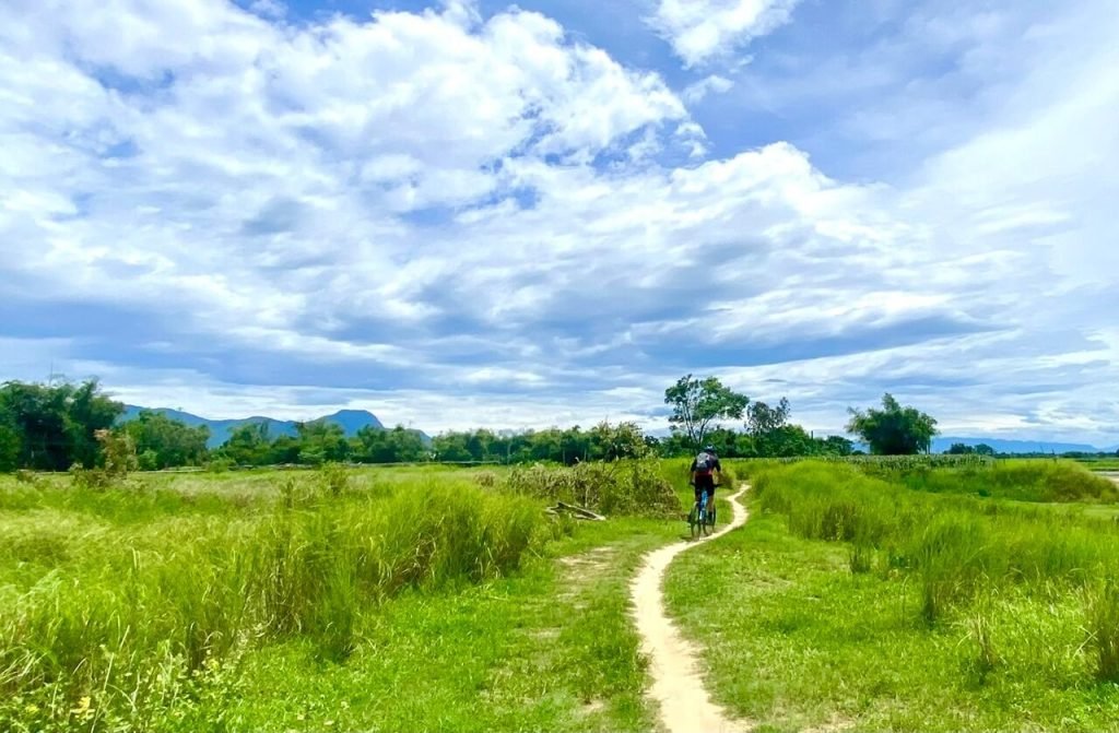 Hoi-An-Countryside-Bike-Tour-peaceful-trail-along-the-river-bank